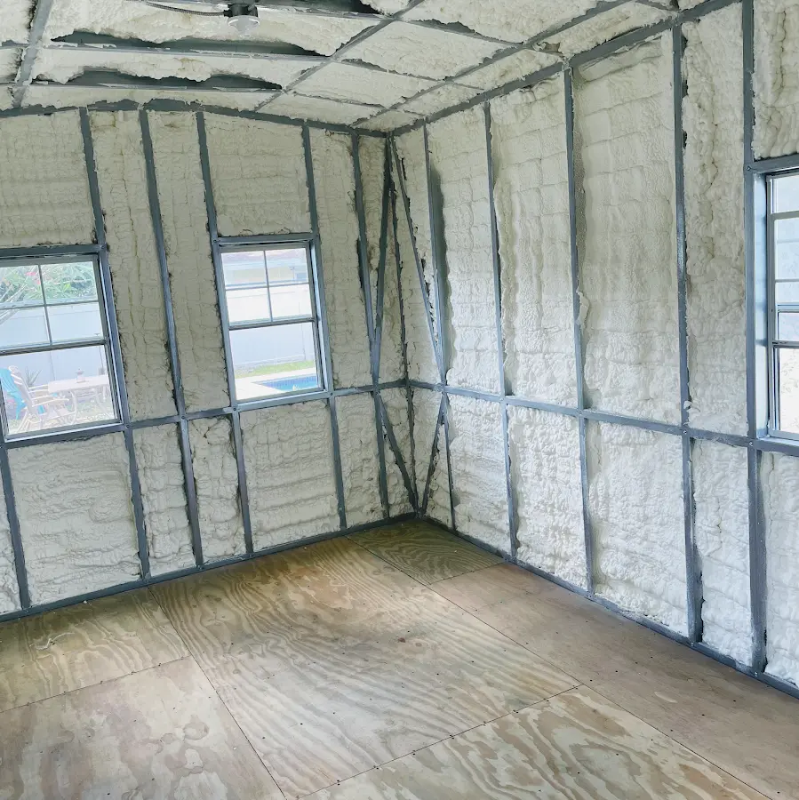 Closed-cell spray foam insulation applied to wall cavities in a residential project in Middlebury